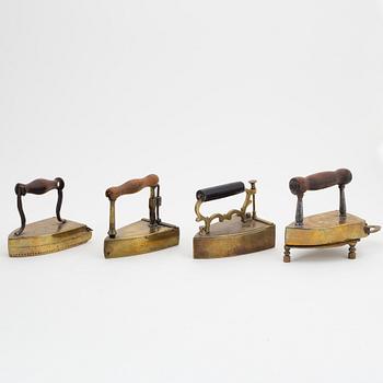 A set of four Swedish brass irons, 18th/19th Century.