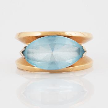 18K gold and navette shaped blue topaz.