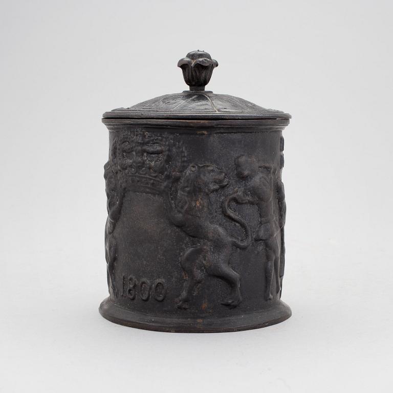 A cast iron lidded tobacco jar, 19th Century.