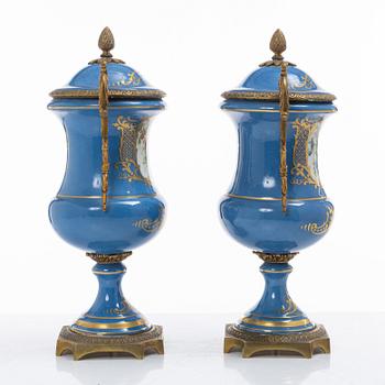 Decorative urns, a pair, porcelain, Sevres-like mark, circa 1900.