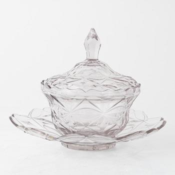 A pair of lidded glass bowls with stands, late 19th century.