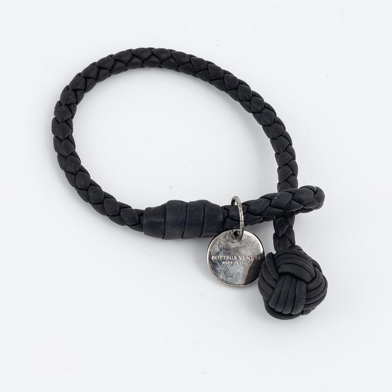 Bottega Veneta, a wallet and bracelet.