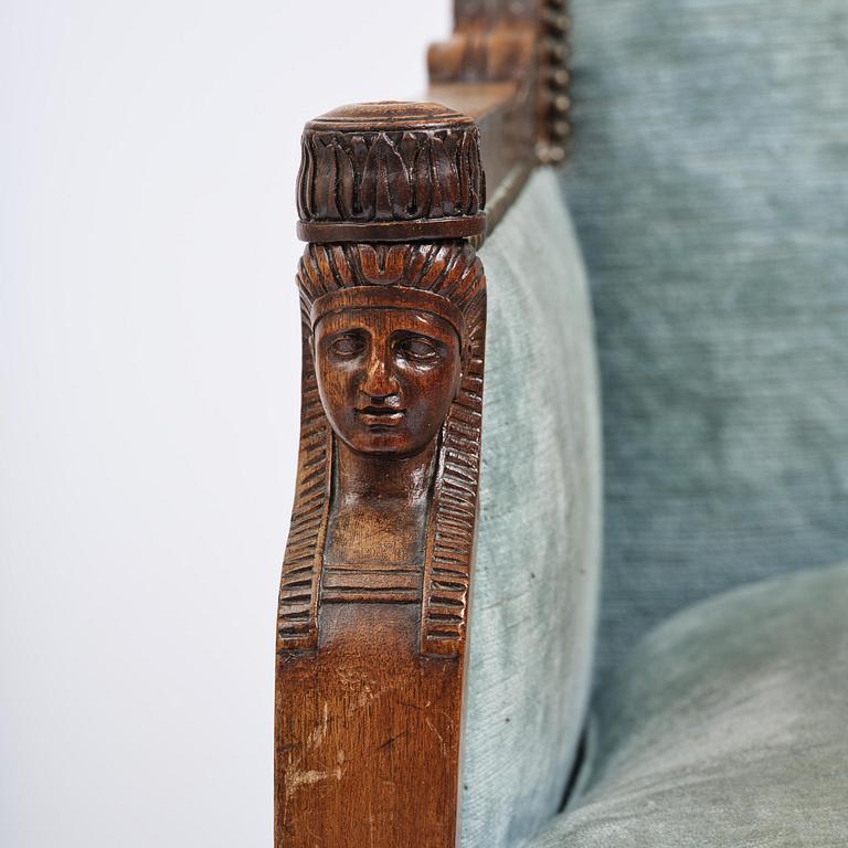 A pair of French Empire mahogny armchairs.