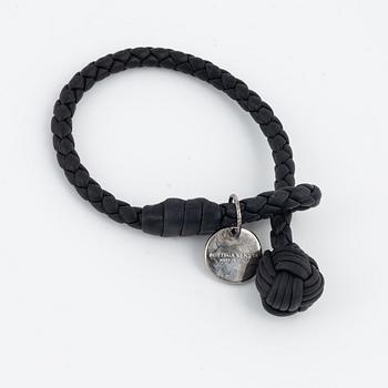 Bottega Veneta, a wallet and bracelet.