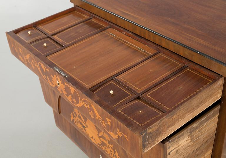 An empire chest of drawers, 19th century.