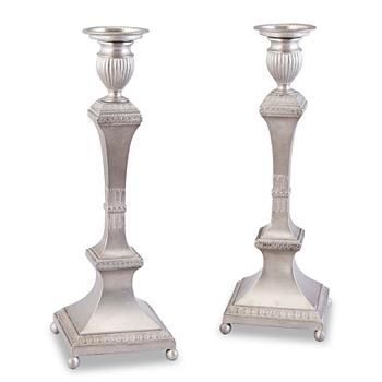 A PAIR OF SWEDISH PEWTER CANDLESTICKS.