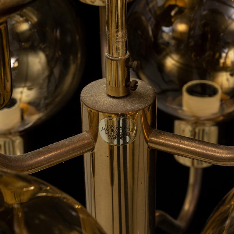 Hans-Agne Jakobsson, a late 20th century brass and glass ceiling lamp for nine lights, Markaryd, Sweden.