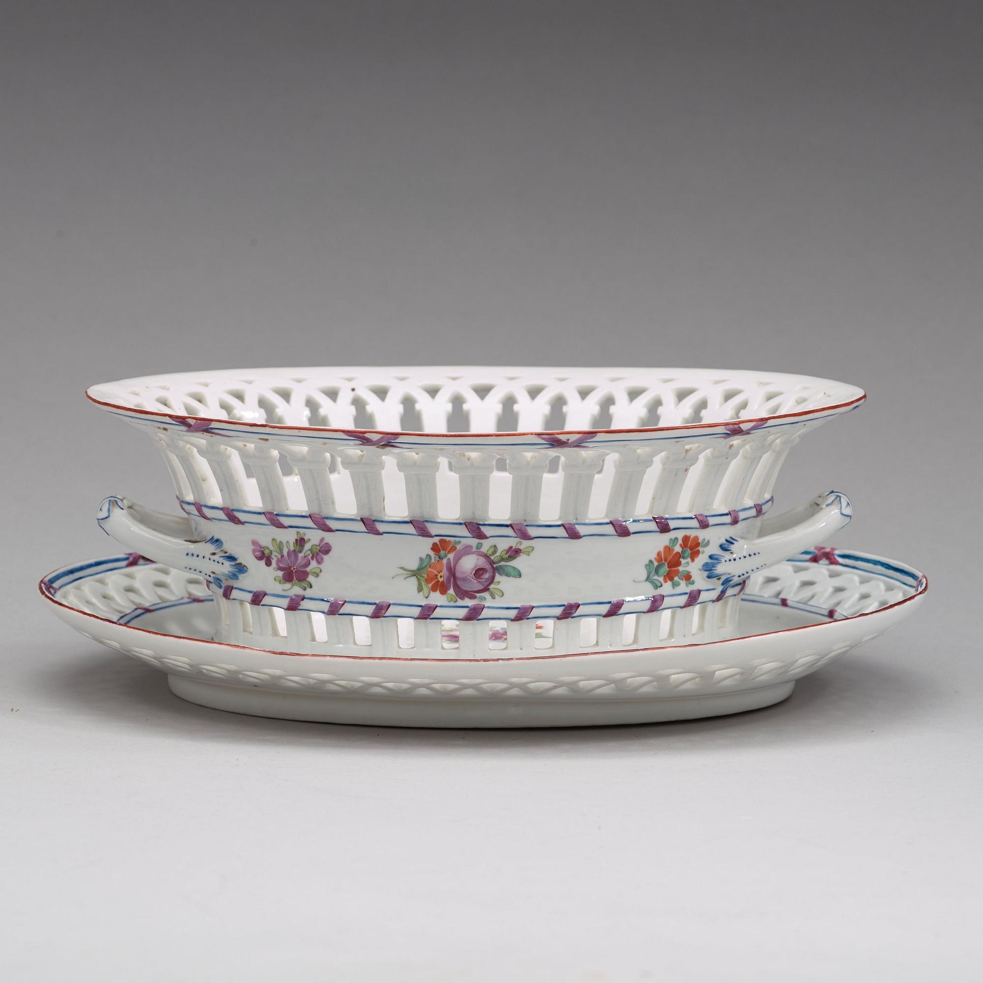 A Russian chesnut basket and stand, Imperial Porcelain Manufactory, St Petersburg, period of Alexander I (1801-25).