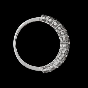 A brilliant- and emerald cut diamond ring.