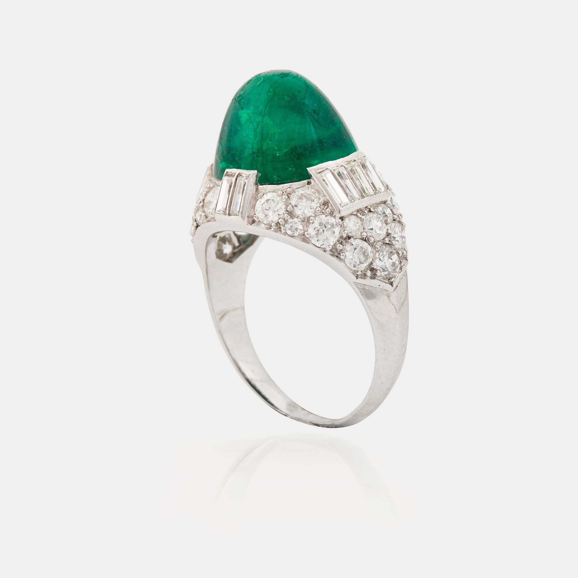 A cabochon-cut emerald, baguette, single and brilliant-cut diamond ring.