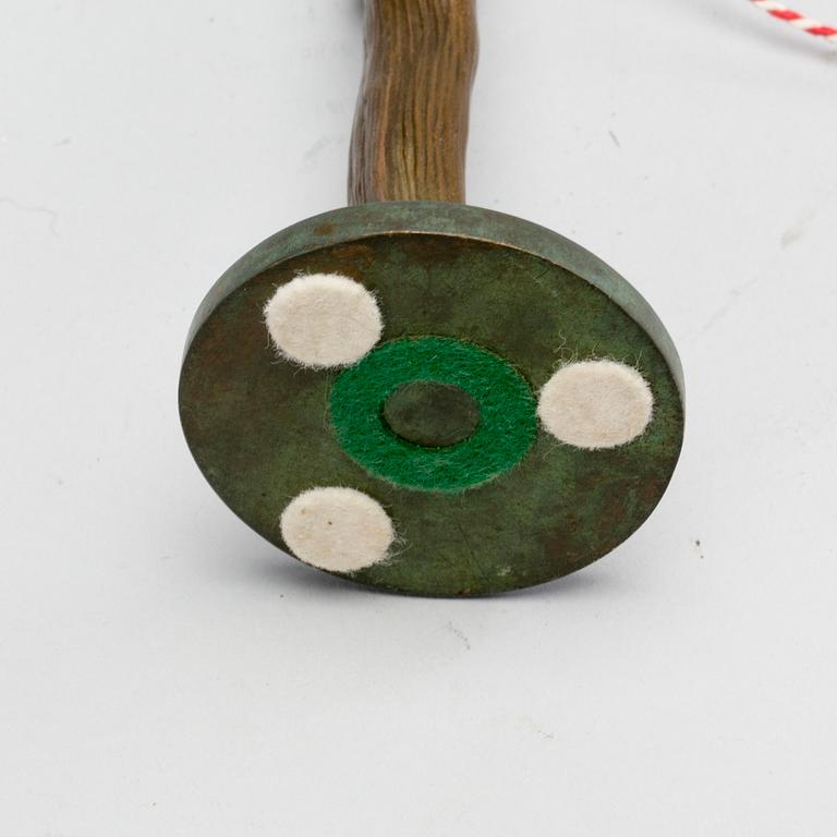 FIGURIN, mongramsignerad (?), jugend, patinerad brons.