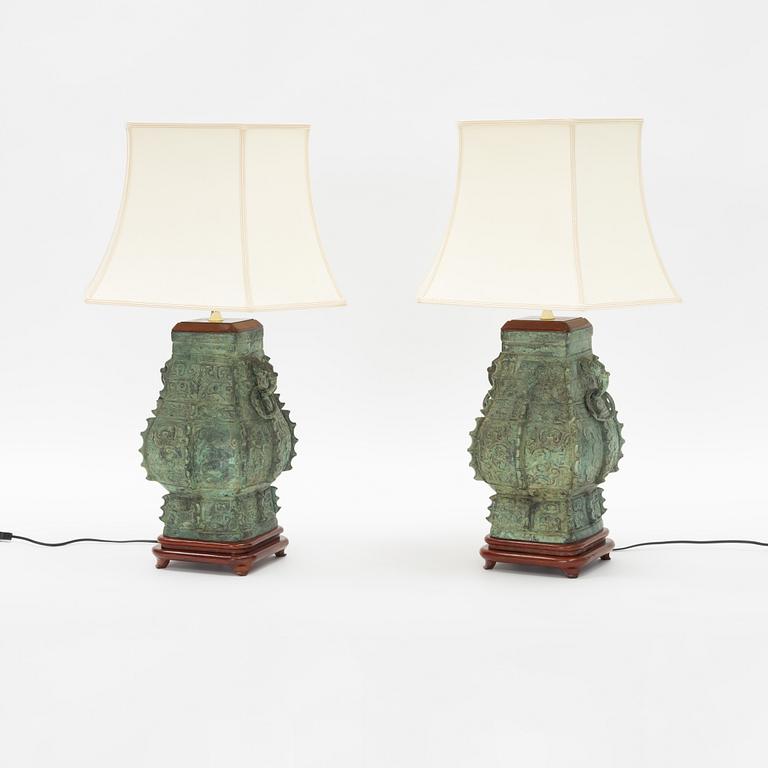 A pair of archaistic bronze vases made in to lamps, China, 20th Century.