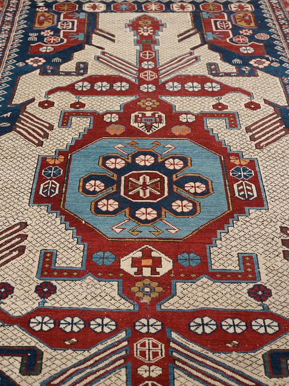 A CARPET, an antique/semi-antique Shirvan, ca 234 x 130 cm (as well as the ends with 1 cm flat weave).