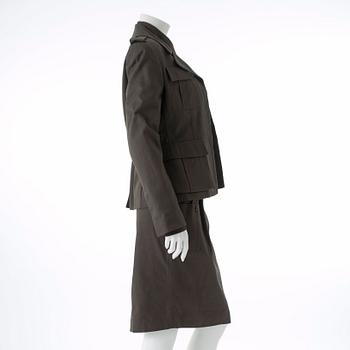 GUCCI, a three-piece suit consisting of jacket, shirt and skirt.