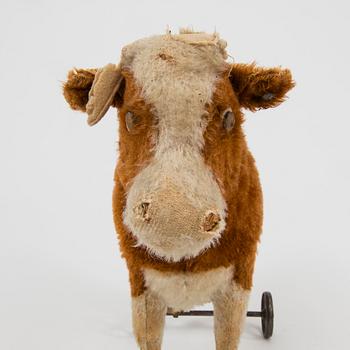 A Steiff cow and a Schuco "Tricky", Germany, 1910 and 1930/40s.