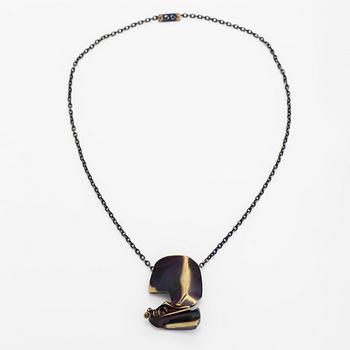 Björn Weckström, A flame bronze necklace "International arms Inc" and ring "Henry J". Lapponia.