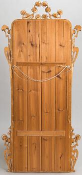 An Art Nouveau mirror with console table from early 20th century.