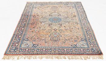 An oriental rug, circa 245 x 136 cm.