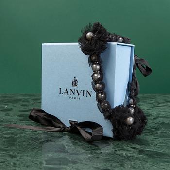 A NECKLACE by LANVIN.