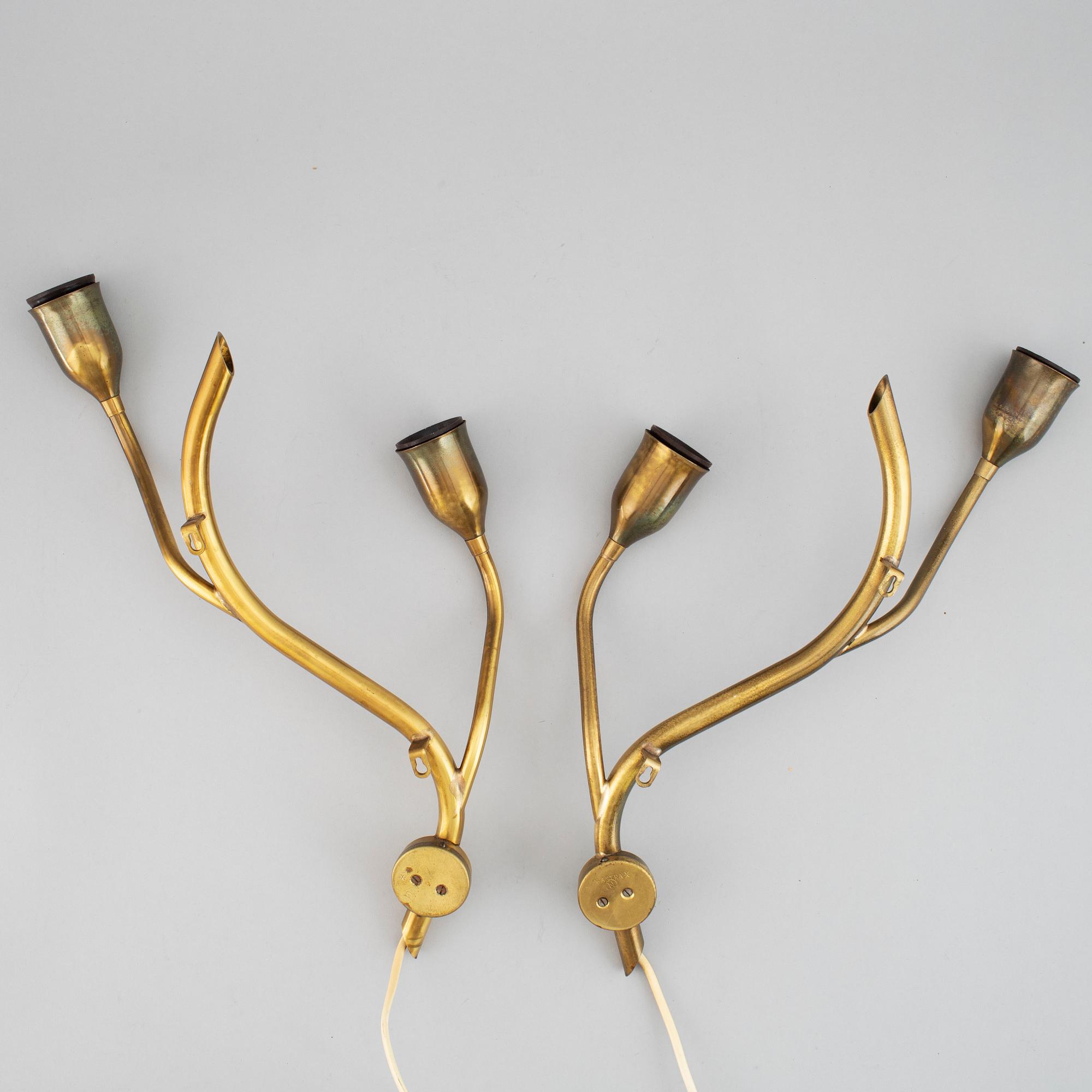 A pair of Astra brass wall lamps, mid 20th century.