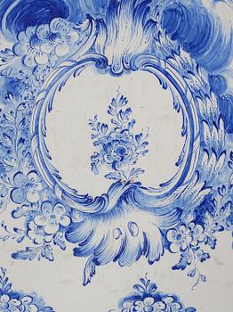 A rococo faience-top tea table, Rörstrand 1765.