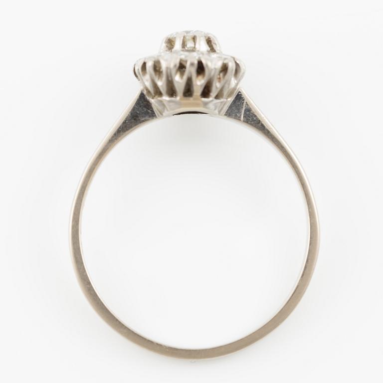 A ring and a pair of earrings in 18K white gold set with round brilliant-cut and octagonal-cut diamonds.