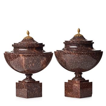 A pair of late Gustavian early 19th century porphyry urns with cover.