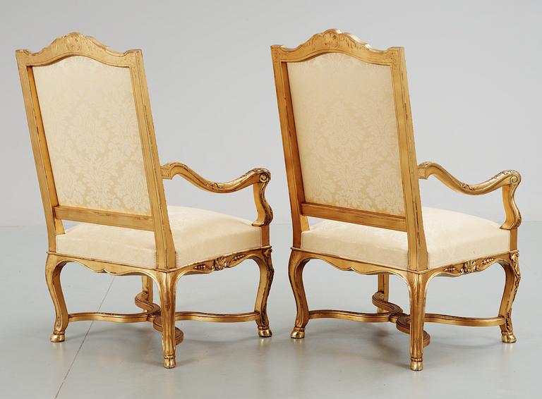 A pair of Régence-style circa 1900 armchairs.