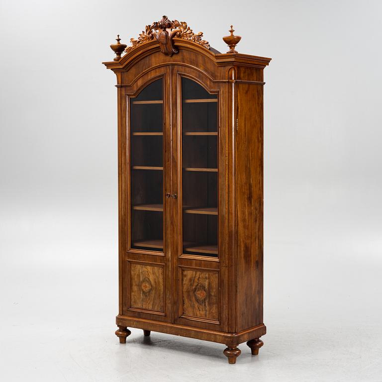 A mahogany veneered book cabinet ,second part of the 19th Century.