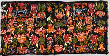 A carriage cushion, "Urnor och par", tapestry weave, ca 96 x 48,5 cm, Scania (Sweden), 19th century.