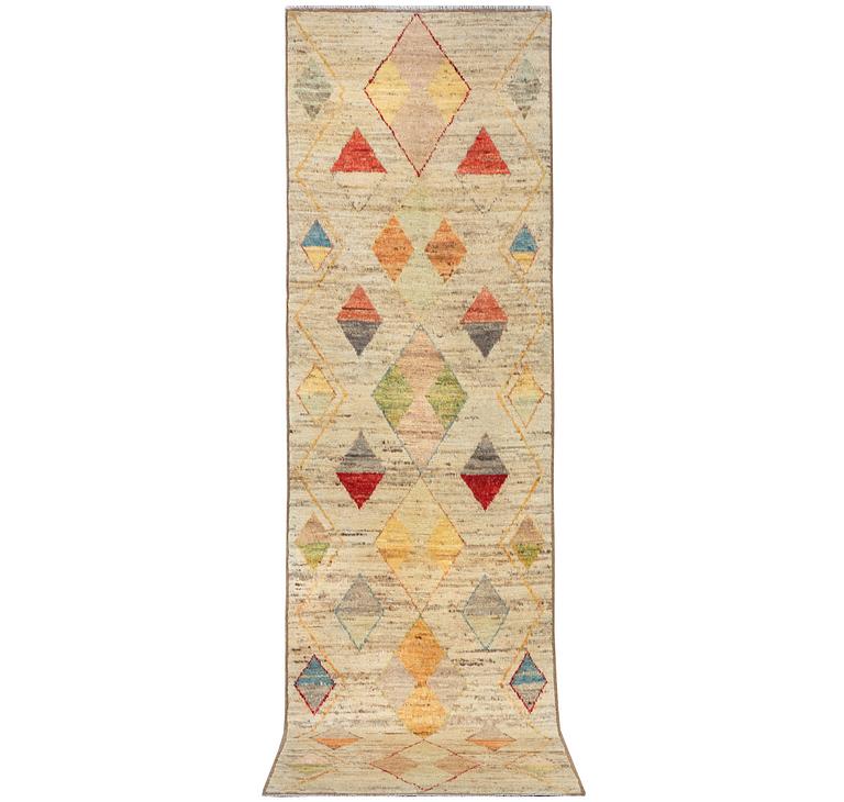 A runner carpet, Morocco, c. 392 x 101 cm.