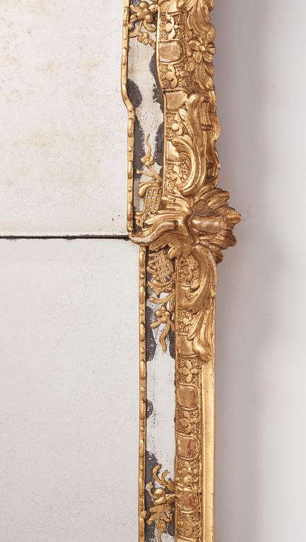 A Swedish rococo giltwood mirror, later part of the 18th century.