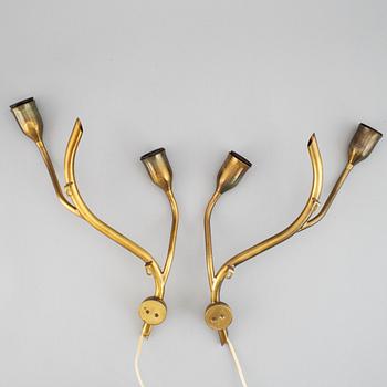 A pair of Astra brass wall lamps, mid 20th century.