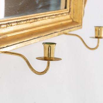 A 19th century two-light mirror sconce.