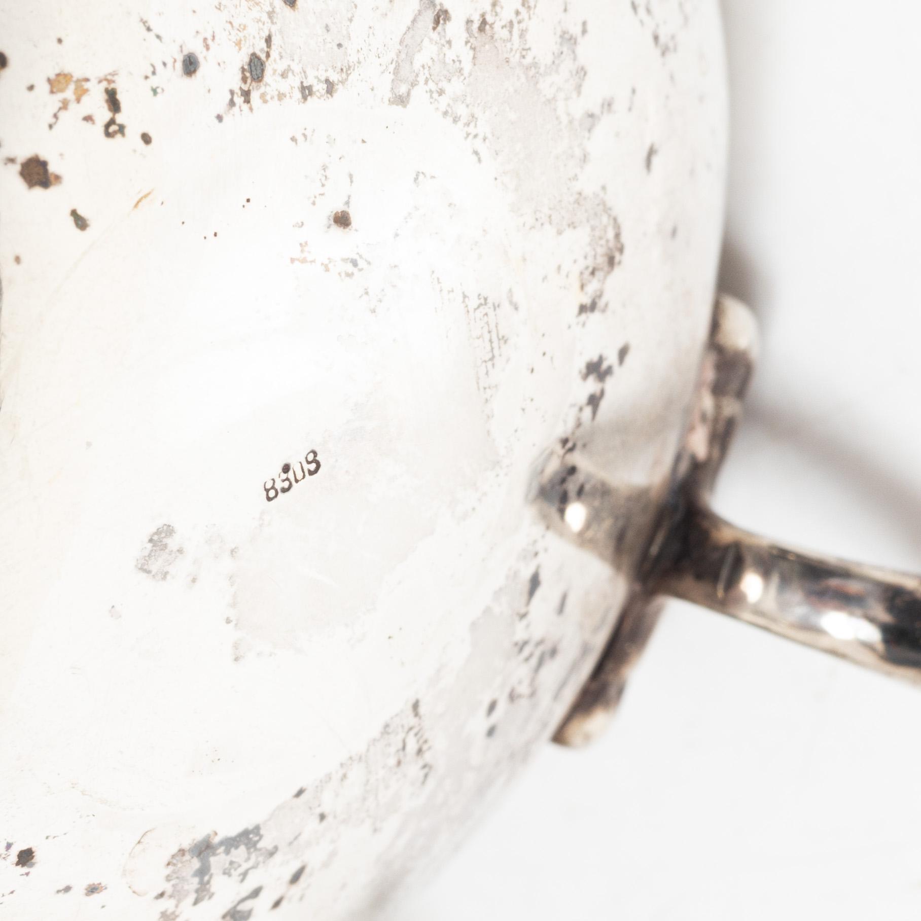 Two silver jugs, one English.