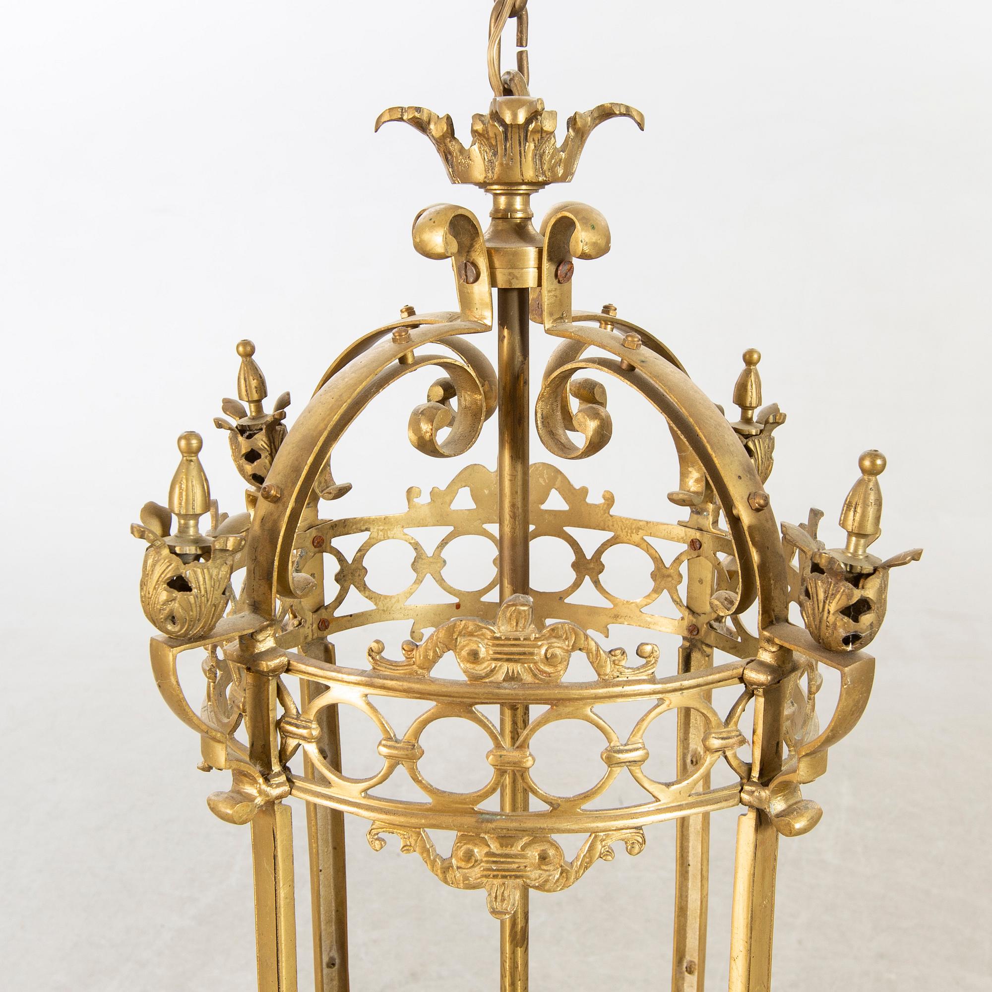 A 20th century brass ceiling lamp in Louis XV-style.