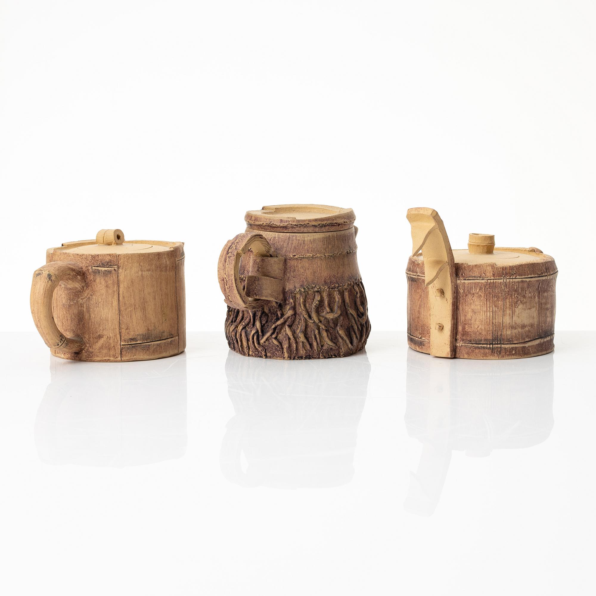 A group of three bright yellow yixing 'Gongfu' teapots, China, 1990s.