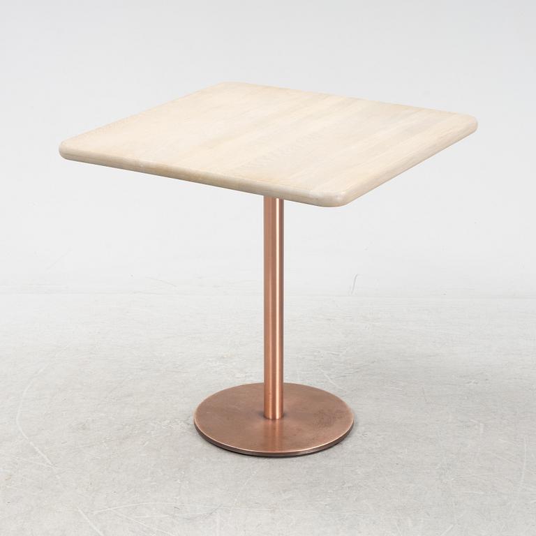 A steel and oak table by Jonas Lindvall 2011.