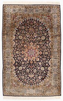 A Ghom, silk rug, c. 162 x 102 cm.