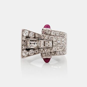 An odeonesque cabochon cut ruby, old- and step- cut diamond ring. Circa 1940's.