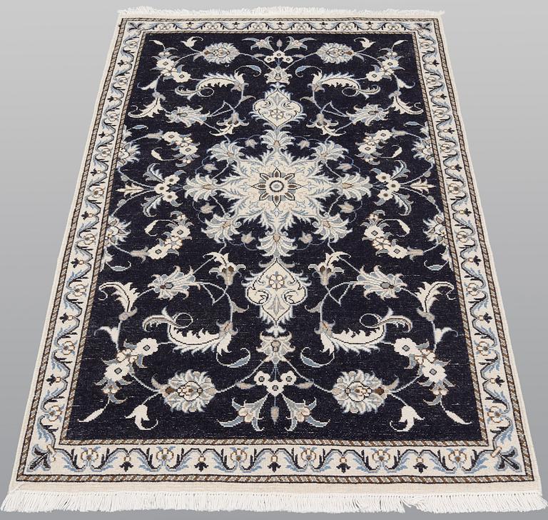 A pair of Nain rugs, ca 135 x 90 & 134 x 89 cm.