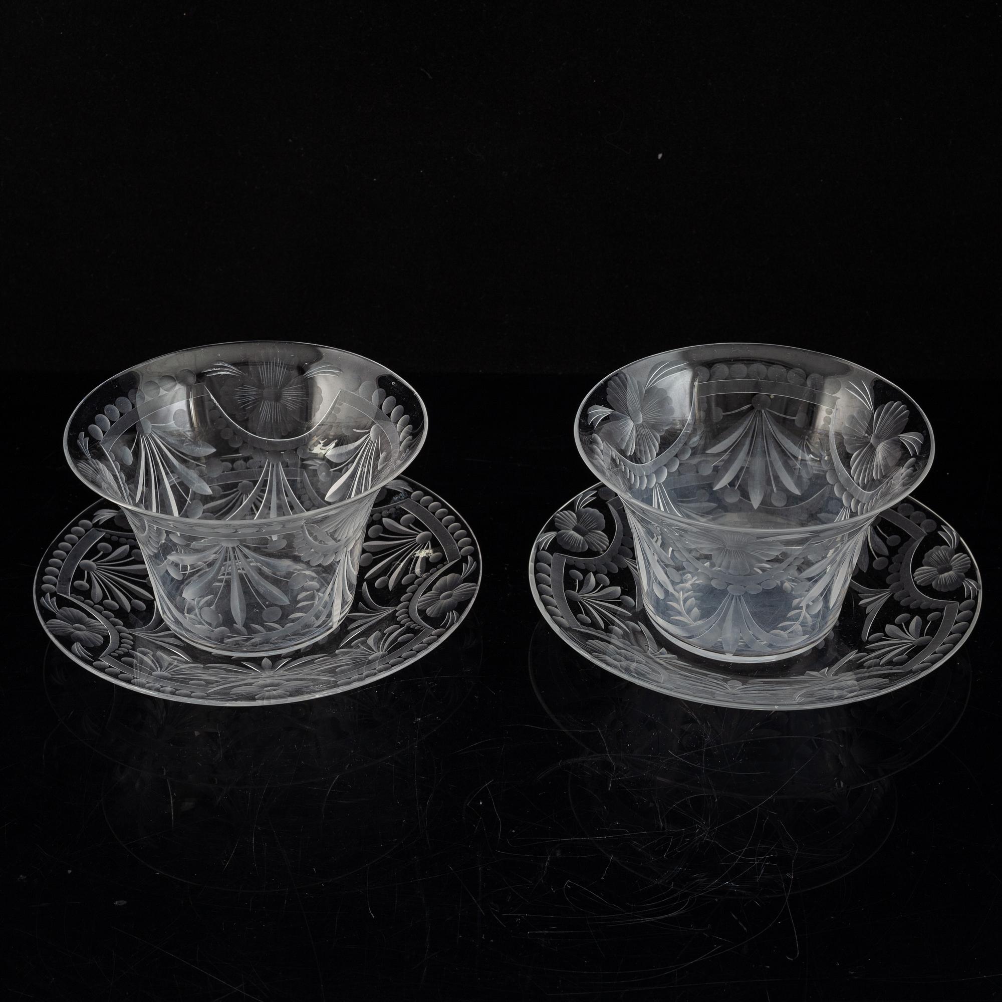 A pair of glass bowls with dishes, 20th century.