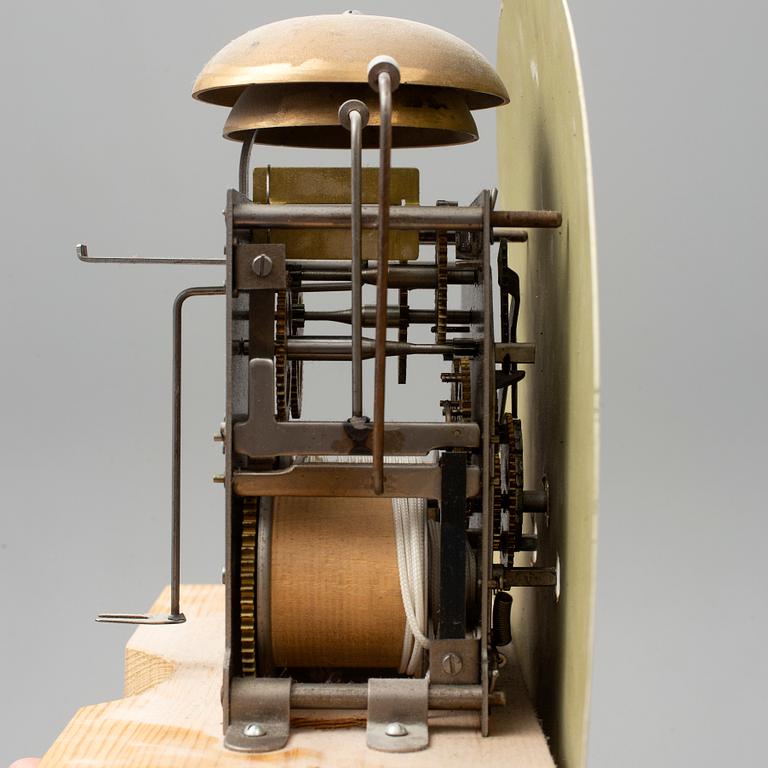 A combined clock and chest of drawers from late 19th  century.