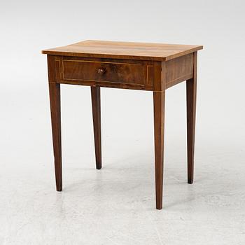 A mahogany veneered table, circa 1800.