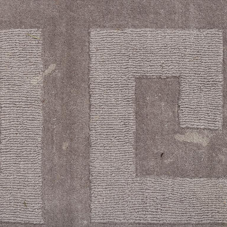 A Layered "Wool Cubes" carpet, 390x620 cm.