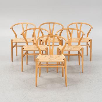 Hans J Wegner, a set of 6 model CH-24, "Wishbone" chairs, Carl Hansen & Son, Odense, Denmark, one dated 2007.