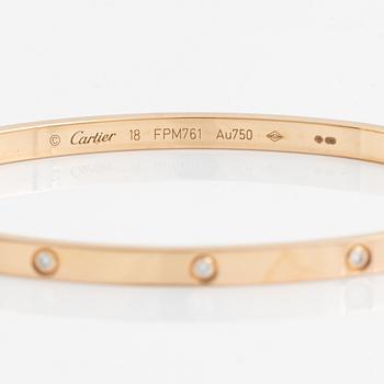 A Cartier "Love" bracelet small model in 18K rose gold with ten round brilliant-cut diamonds.