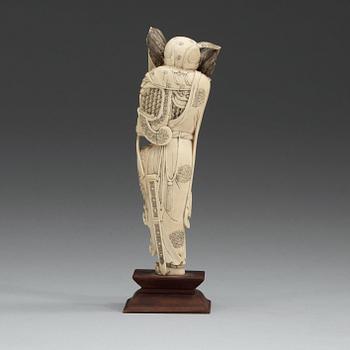 An carved ivory sculpture of a guardsman, China, early 20th Century.