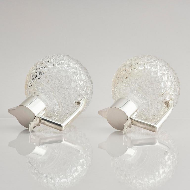 A Swedish pair of silver and cut-glass decanters, mark of C.G. Hallberg, Stockholm 1893.