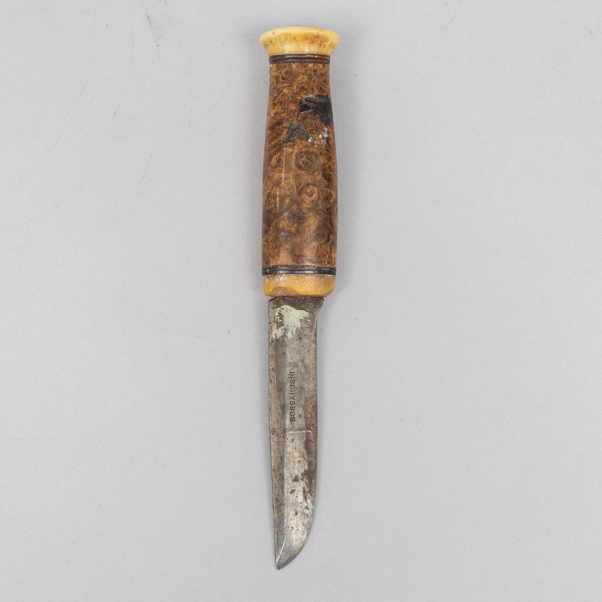 Per Erik Svonni, a reindeer horn knife, signed and dated 1928.